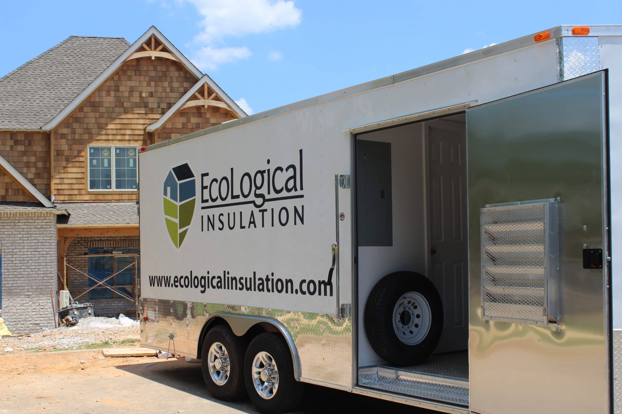 a trailer loading into a house under construction